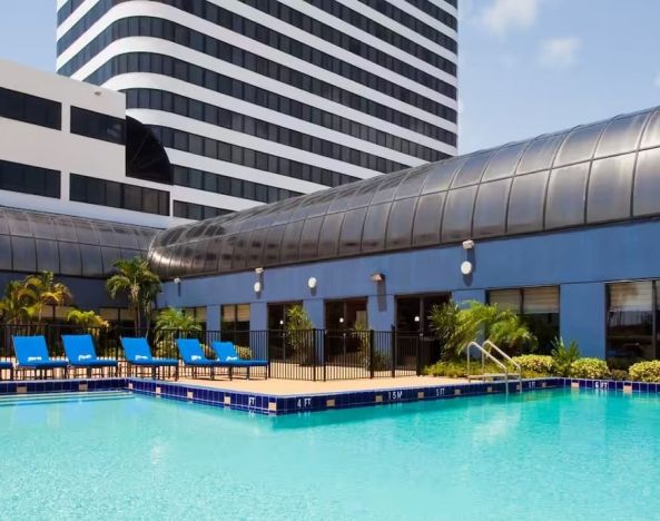 Stunning outdoor pool at Embassy Suites By Hilton West Palm Beach Central.