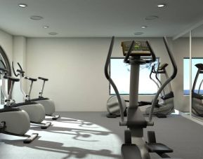 Well equipped fitness center with stationary bikes at Doubletree By Hilton Toluca.