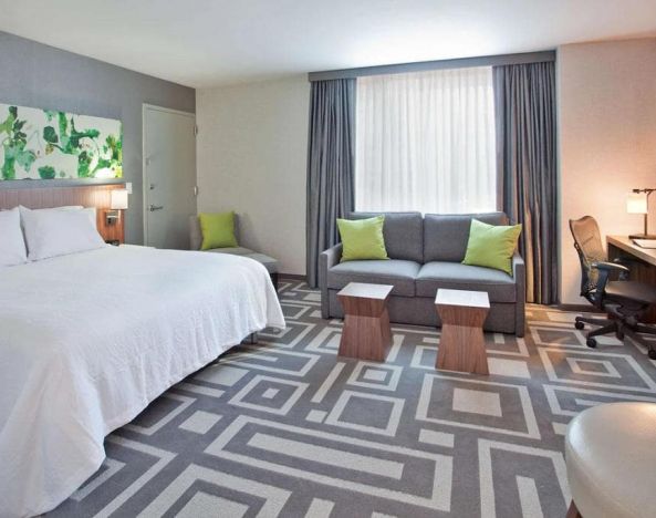 Guest room in Hilton Garden Inn New York Central Park South Mid-town West, with workspace desk and chair.