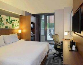 Double bed guest room at the Hilton Garden Inn New York Central Park South Mid-town West, with adjoining patio.