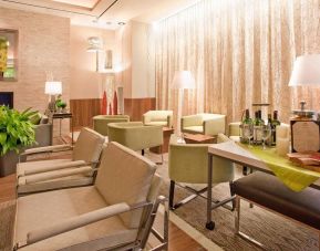 The lounge in the hotel’s reception area, with comfortable seating and small tables.