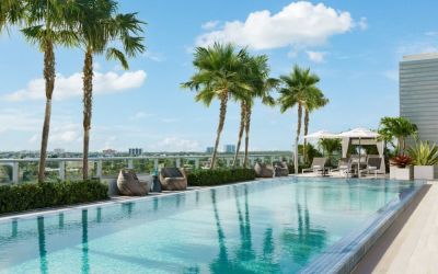 Relaxing pool area with sun chairs at The Altair Hotel Bay Harbor.