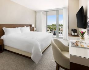 Spacious king bedroom with work desk at The Altair Hotel Bay Harbor.