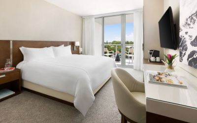 Spacious king bedroom with work desk at The Altair Hotel Bay Harbor.