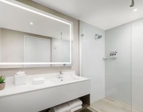 Private guest bathroom with shower at The Altair Hotel Bay Harbor.