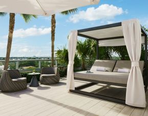 Relaxing cabanas available by the pool at The Altair Hotel Bay Harbor.