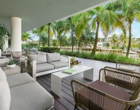 Comfortable outdoor lounge and coworking space at The Altair Hotel Bay Harbor.