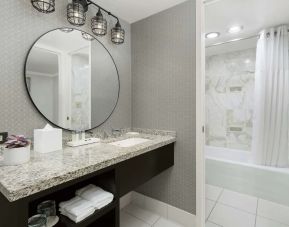 Private guest bathroom with bath and shower at Stanford Court San Francisco.