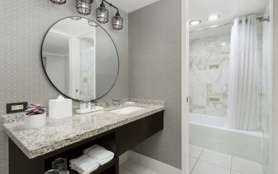 Private guest bathroom with bath and shower at Stanford Court San Francisco.