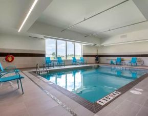 Relaxing indoor pool with seating area at Comfort Inn & Suites Napanee.