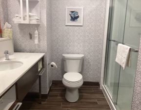 Private guest bathroom with shower at Hampton Inn By Hilton Port Hope.