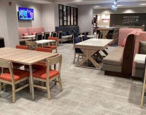 Dining and coworking space at Hampton Inn By Hilton Port Hope.