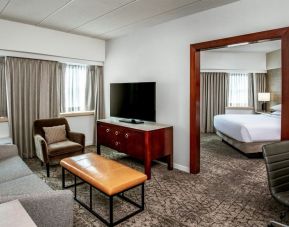 Spacious delux king room with lounge area and TV at Sheraton Needham.