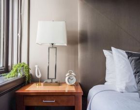 King bedroom with natural light at Magnolia Dallas.