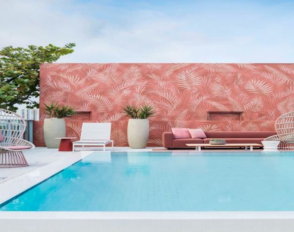 Luxurious pool area with seating at Novotel Miami Brickell.