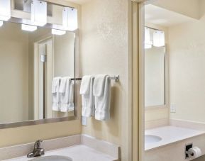 Private guest bathroom with shower at Golden Sails Hotel Long Beach.