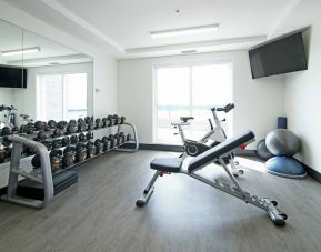 Equipped fitness center at Holiday Inn & Suites Calgary Airport North.