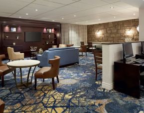 Lounge and coworking space at Sheraton Montreal Airport Hotel.