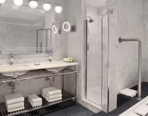 Private guest bathroom with shower and bath at The Drake Hotel.