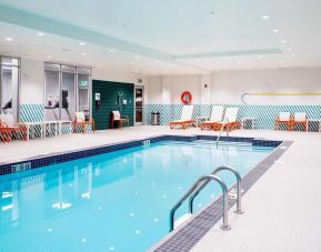 Lovely indoor pool with pool chairs at Holiday Inn Edmonton South - Evario Events.