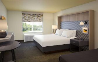 King bedroom with natural light at Holiday Inn Edmonton South - Evario Events.