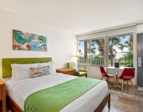 Spacious king room with TV and business desk at Hilton Garden Inn Shenzhen Baoan Huaide.