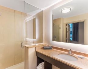 Guest bathroom with shower at La Quinta Inn & Suites Chicago Downtown.