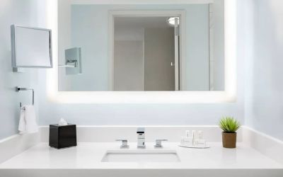 Well-lit guest bathroom with shower at Courtyard Boston Cambridge.