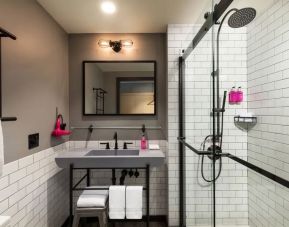 Private guest bathroom with shower at Moxy Boston Downtown.