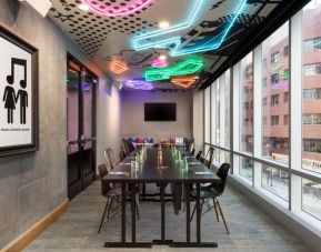 Professional and well-lit meeting room at Moxy Boston Downtown.