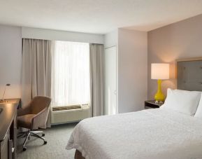 Delux king room with TV and work space at Hampton Inn Manhattan Chelsea.