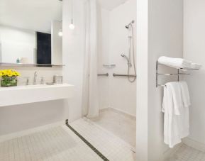 Guest bathroom with shower at Nu Hotel - Brooklyn.