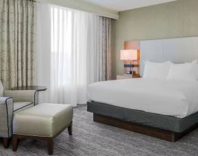 King bed with natural light at DoubleTree Atlanta Airport.