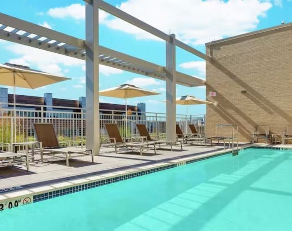 Lovely outdoor pool with pool chairs at Hilton Garden Inn Washington DC / Georgetown Area.