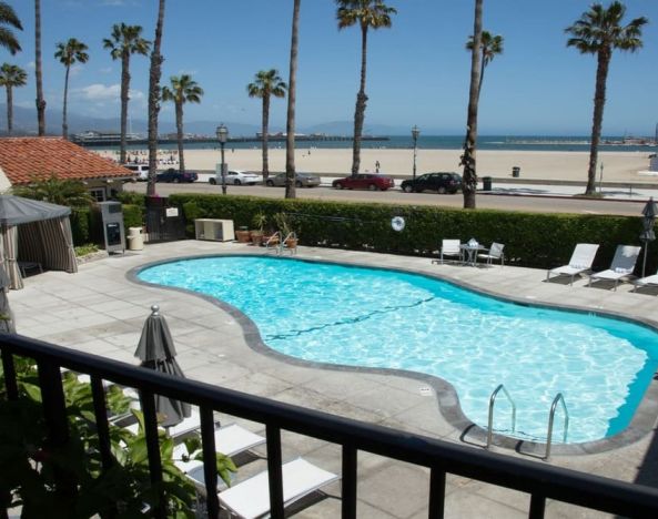 Stunning outdoor pool with sunbeds at Hotel Milo Santa Barbara.