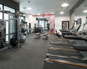 Well equipped fitness center at Courtyard By Marriott Houston Heights/I-10.
