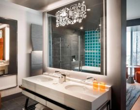 Private guest bathroom with shower at Hotel Nia, Autograph Collection.