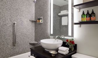 Private guest bathroom with shower and bath at Capitol Hill Hotel.