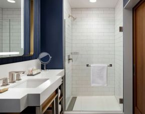 Private guest bathroom with shower and bath at Hotel Caza.
