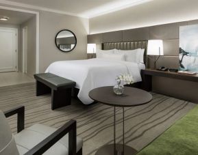 Comfortable king bedroom with lounge area at The Westin New Orleans.