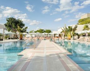 Stunning outdoor pool with pool seating area at The Goodtime Hotel.