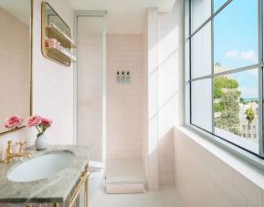 Guest bathroom with shower at The Goodtime Hotel.