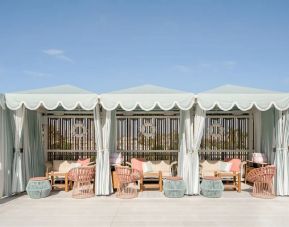 Shaded seating area outside ideal for coworking at The Goodtime Hotel.