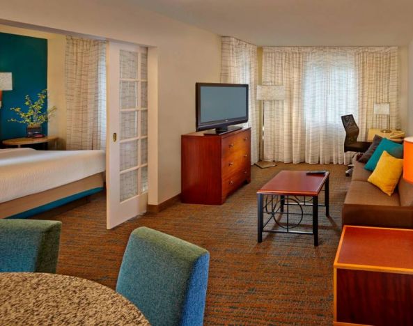 Day use room with TV and lounge area at Residence Inn Boston Tewksbury.
