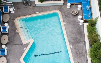Refreshing outdoor pool surrounded by sun loungers at Maison 140 Beverly Hills.