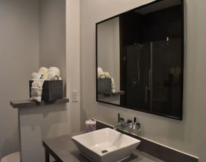 Private guest bathroom with shower at Hotel Bella.