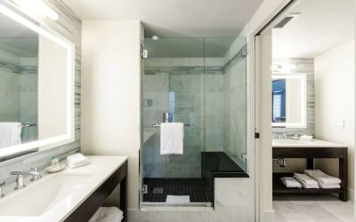 Private guest bathroom with shower at The Mosaic Hotel Beverly Hills.