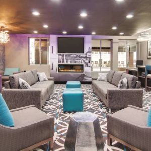 Lobby and coworking lounge at La Quinta Inn & Suites Cleveland Airport West.