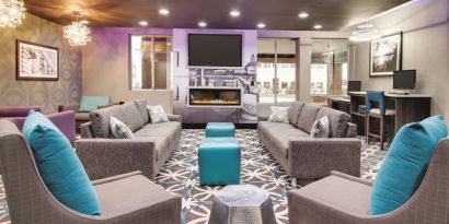 Lobby and coworking lounge at La Quinta Inn & Suites Cleveland Airport West.