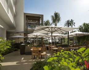 Pretty outdoor terrace and coworking space at Alohilani Resort Waikiki Beach.